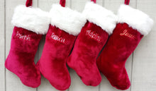 CHRISTMAS STOCKINGS This luxurious plush 21'' Christmas stocking is a deep burgundy color with faux fox fur trim.