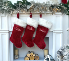 This luxurious plush 21'' Christmas stocking is a deep burgundy color with faux fox fur trim.